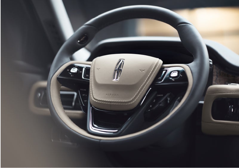 The intuitively placed controls of the steering wheel on a 2023 Lincoln Aviator® SUV | Duncan Lincoln in Blacksburg VA