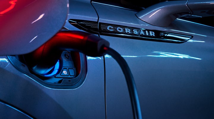 A charger plugged into the charging port of a 2024 Lincoln Corsair® Plug-in Hybrid model. | Duncan Lincoln in Blacksburg VA